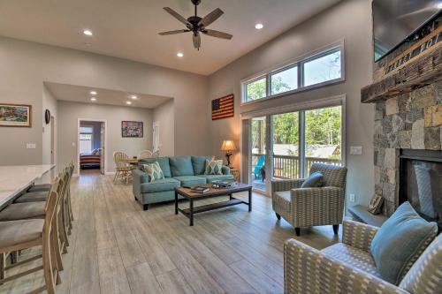 a living room with a couch and a fireplace at Covered Deck, Grill and Game Room Gilford House! in Gilford