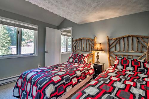 two beds sitting next to each other in a bedroom at Condo with Furnished Deck - Walk to Sugar Mountain! in Sugar Mountain