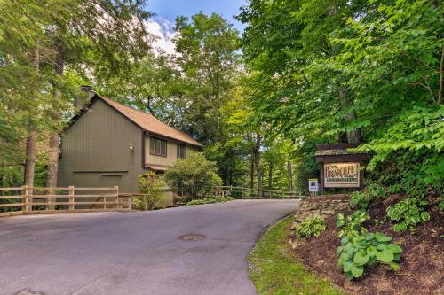a driveway leading to a house with a sign at Condo with Furnished Deck - Walk to Sugar Mountain! in Sugar Mountain