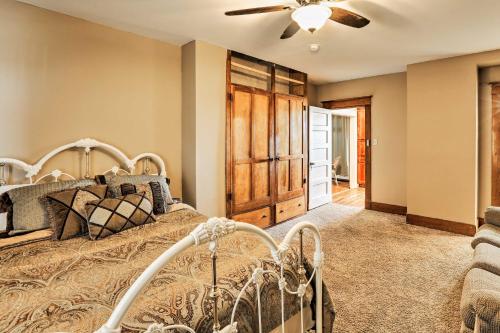 a bedroom with a bed and a ceiling fan at Lovell Home Drive to Bighorn Mtn, Yellowstone in Lovell