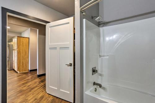 a bathroom with a shower and a white door at Black Hills Retreat about 3 Mi to ATV Trails! in Piedmont
