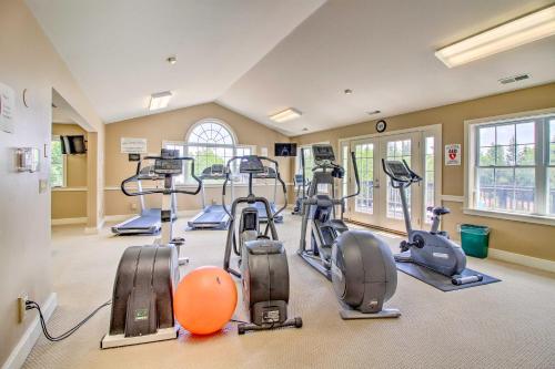 a gym with several treadmills and elliptical machines at Renovated Ski-InandSki-Out Peru Condo at Bromley Mtn in Peru