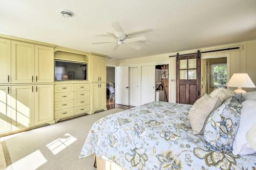 a bedroom with a bed and a ceiling fan at Ephraim Home with Yard - Walk to Lake Michigan! in Ephraim