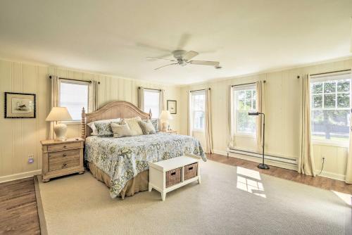 a bedroom with a bed and a ceiling fan at Ephraim Home with Yard - Walk to Lake Michigan! in Ephraim