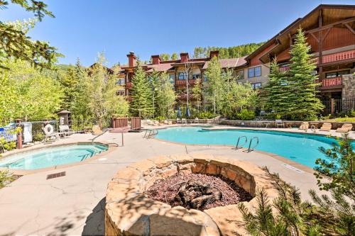 a resort with a swimming pool and a fire pit at Solitude Mountain Resort Condo at Lift Base! in Solitude