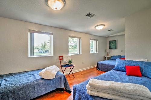 a bedroom with two beds and a couch at Ottawa Lake Home with BBQ and Patio, 15 Mi to Toledo in Sylvania