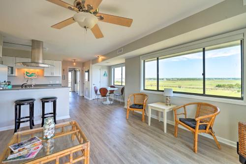 a kitchen and living room with a ceiling fan at Carolina Beach Home with Views and Pool Access! in Carolina Beach