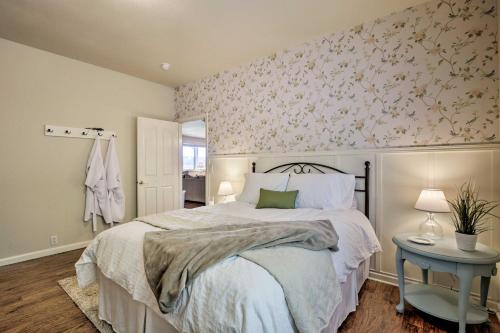 a bedroom with a bed with a floral wall at McMinnville Wine Country Home with Hot Tub and Deck in McMinnville