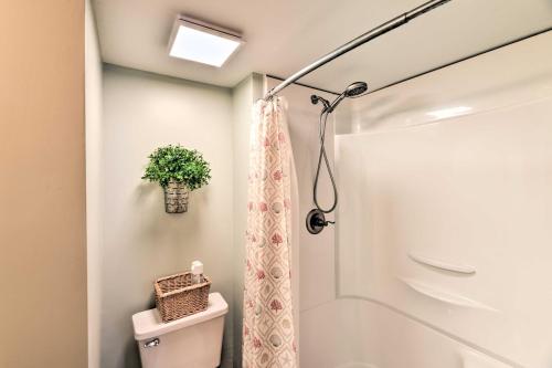 a bathroom with a shower and a toilet at Summer Winds Resort Condo with Ocean Views! in Atlantic Beach