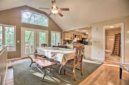 a dining room with a table and a ceiling fan at Resort Home on Mountain Golf Course with Deck and View in McGaheysville