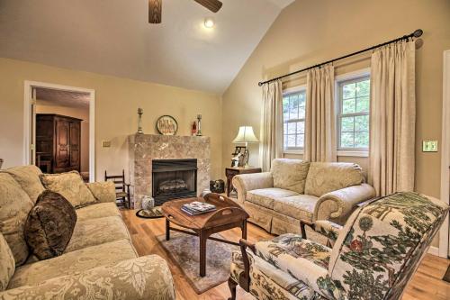 a living room with a couch and a fireplace at Resort Home on Mountain Golf Course with Deck and View in McGaheysville