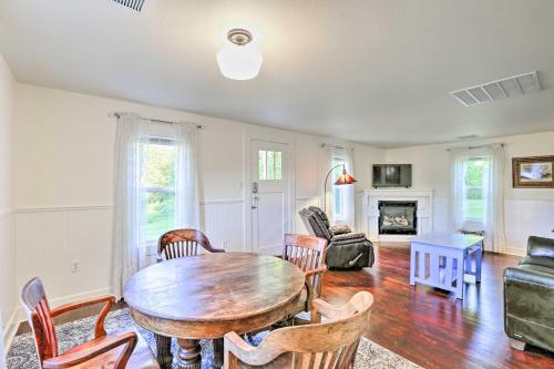 a living room with a wooden table and chairs at Ferndale Cottage on Private 20 Acre Farm! in Ferndale