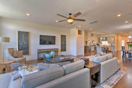 a living room with two couches and a fireplace at Modern Main St Apt in Downtown Waynesville! in Waynesville