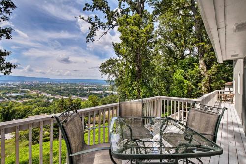 a table and chairs sitting on a balcony with a view at Stay Above it All! Modern Home on Missionary Ridge in Chattanooga