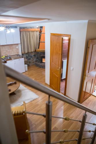 a view of a room with a kitchen and a door at Exohiko in Palaios Agios Athanasios