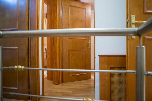 a view of a room with wooden doors at Exohiko in Palaios Agios Athanasios