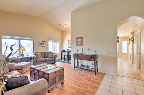a living room with a couch and a table at Walk to NFL Games Glendale Home Near Golf in Glendale