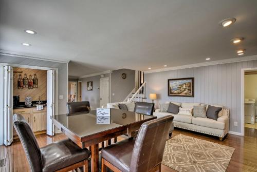 a living room with a table and chairs and a couch at Stay Above it All! Modern Home on Missionary Ridge in Chattanooga