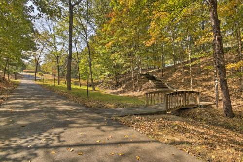 a bench on a path in a park at Couples Cabin - 5 Mi to DT Berkeley Springs! in Berkeley Springs