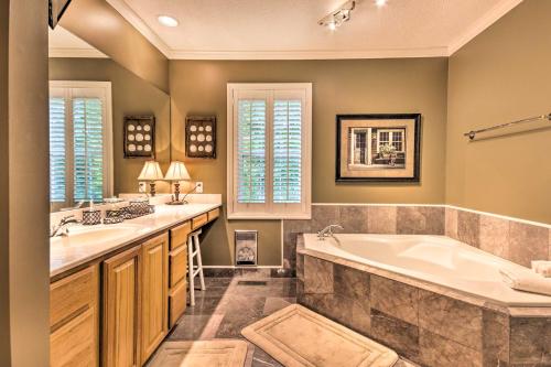 a bathroom with two sinks and a tub at Screened Porch and 3 Decks Beech Mountain Cabin in Beech Mountain