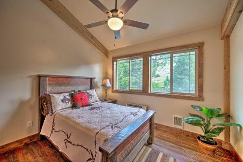 a bedroom with a bed and a ceiling fan at Custom Livingston Apt with Balcony and Mountain Views! in Livingston