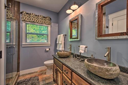a bathroom with two sinks and a toilet at Hiawassee Home with Views Less Than 1 Mi to Lake Chatuge in Hiawassee