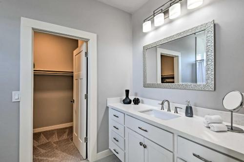 a white bathroom with a sink and a mirror at 7 Mi to Dtwn Phoenix Home with Patio and Yard in Phoenix