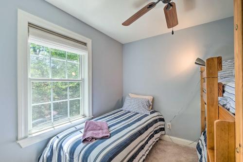 a bedroom with a bed and a window at West Dover Home with Deck, Grill and EV Outlet in West Dover