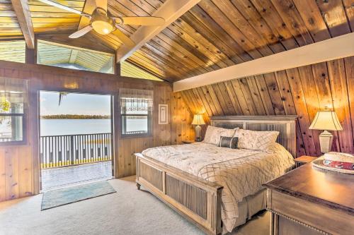 a bedroom with a bed and a wooden ceiling at Waterfront Lake Placid Home Game Rm, Dock, Kayaks in Lake Placid