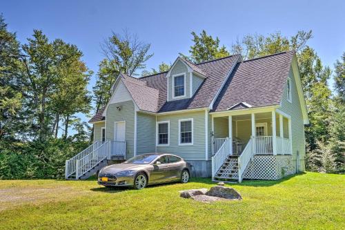 a house with a car parked in front of it at West Dover Home with Deck, Grill and EV Outlet in West Dover