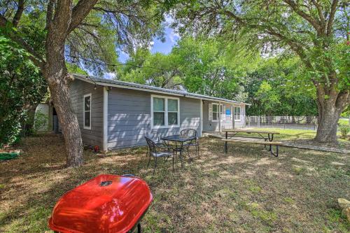 a small house with a picnic table and a bench at Utopia Family Home, 2 Blocks to Utopia Park! in Utopia