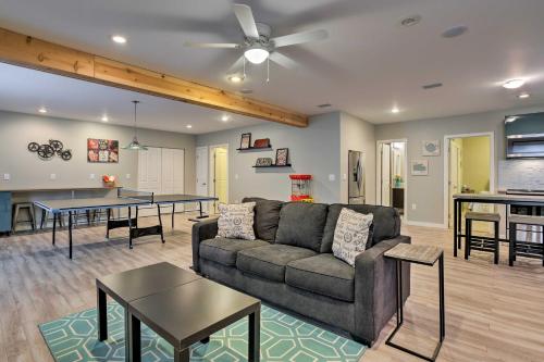 a living room with a couch and a table at 7 Mi to Dtwn Denver Arvada Home with Patio in Arvada