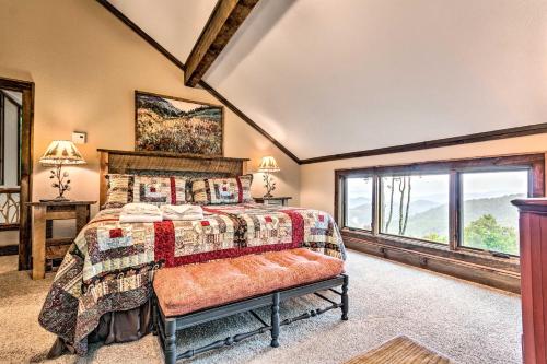 a bedroom with a bed and a large window at 3 Mi to Beech Mtn Treetop Cabin with Deck and Views in Beech Mountain