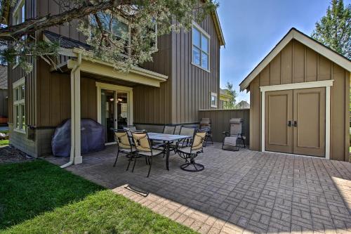 a patio with a table and chairs in front of a house at Redmond House with Community Amenities Access in Redmond