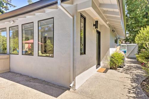 a white house with windows and a sidewalk at Menlo Park Studio about 2 Mi to Stanford University in Menlo Park