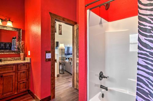 een badkamer met rode muren en een douche bij Mountain-View Gatlinburg Cabin with Private Hot Tub! in Gatlinburg