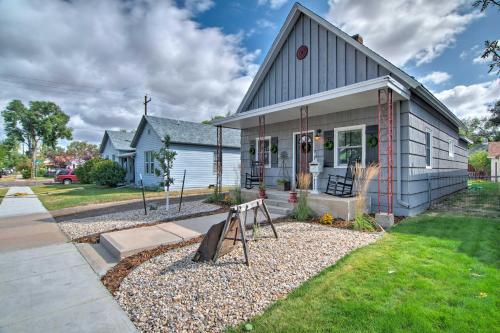 a house with a sign in the front yard at Walk to University Dtown Laramie Home! in Laramie