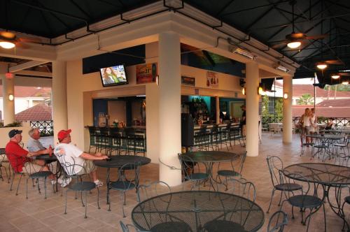 a group of people sitting at tables in a restaurant at Star Island Resort and Club - Near Disney in Kissimmee