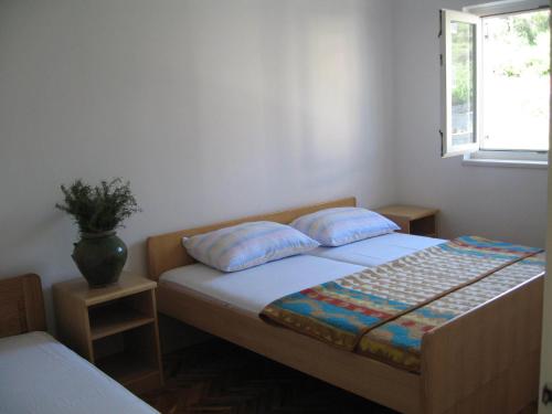 Ένα ή περισσότερα κρεβάτια σε δωμάτιο στο Ljiljana Apartment
