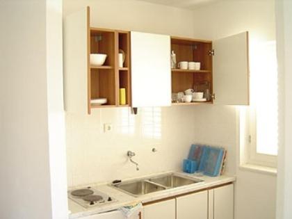 a kitchen with a sink and a counter top at Ljiljana Apartment in Okrug Gornji