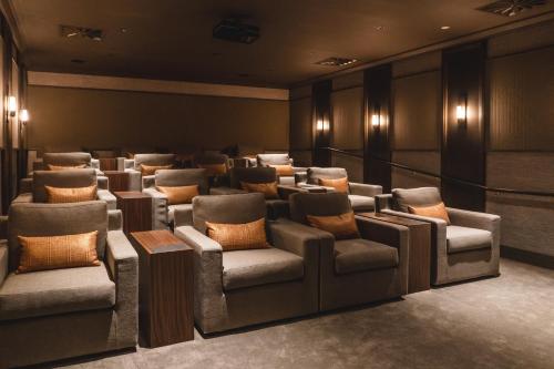 a waiting room with couches and chairs in a building at Gibbston Valley Lodge and Spa in Queenstown