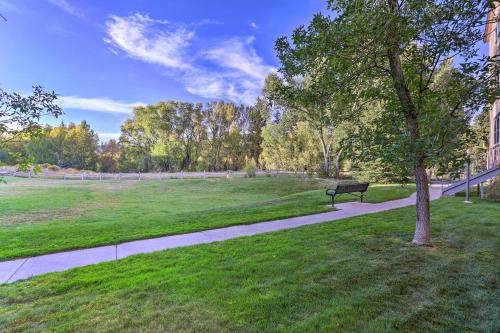 a park with a bench and a tree on a sidewalk at Walkable Dtwn Condo about 5 Miles to Beaver Creek Ski! in Edwards
