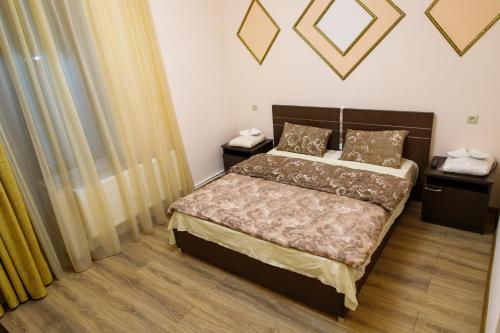 Ένα ή περισσότερα κρεβάτια σε δωμάτιο στο Hotel Gold