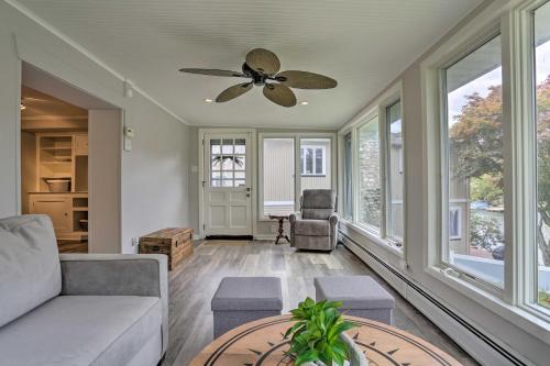 a living room with a couch and a ceiling fan at Lake Hopatcong Family Home with Boat Slip and Dock in Hopatcong