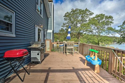 a patio with a bbq and a grill at Lake Hopatcong Family Home with Boat Slip and Dock in Hopatcong