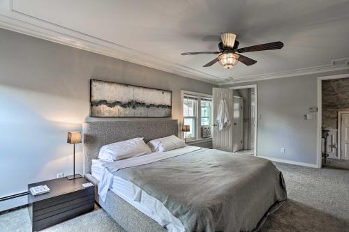 a bedroom with a bed and a ceiling fan at Lake Hopatcong Family Home with Boat Slip and Dock in Hopatcong