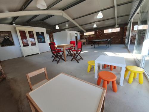 a room with tables and chairs and a table at Quinta da Bizelga Cottages in Tomar