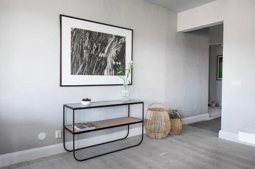 a black and white living room with a table at Sands Hotell in Sandhamn