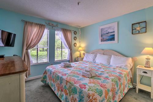 a bedroom with a large bed and a window at Colorful Resort Condo with Beach and Pool Access! in Hilton Head Island