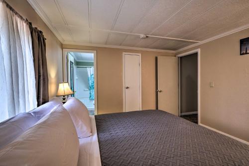 a bedroom with a bed and a window at 3 Mi to Lake Powell Page Home with Patio and BBQ in Page